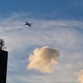 写真: 雲と飛行機