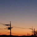 写真: オレンジ色が綺麗な夕日（1月16日）
