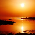 写真: 落陽　能登は赤住海岸